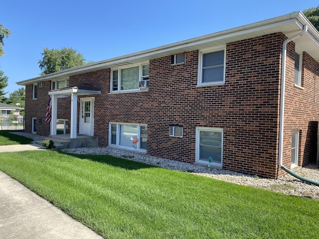265 E Prairie St, Manhattan, IL 60442 - bi-level home with brick siding and a front lawn