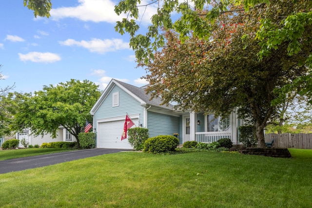 1585 Belle Haven Dr, Grayslake, IL 60030 - view of property hidden behind natural elements featuring covered porch, asphalt driveway, and a garage