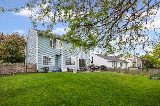 1585 Belle Haven Dr, Grayslake, IL 60030 - back of property with central AC unit, a patio, and a gate