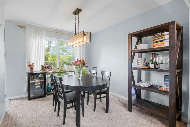 1585 Belle Haven Dr, Grayslake, IL 60030 - carpeted dining space with baseboards and beverage cooler