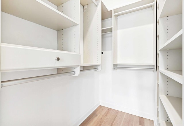 921 N Honore St Unit B, Chicago, IL 60622 - walk in closet with light wood-style floors