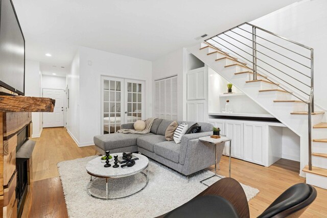 921 N Honore St Unit B, Chicago, IL 60622 - living room featuring stairs, french doors, light wood-style flooring, recessed lighting, and baseboards