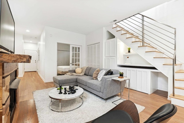 921 N Honore St Unit B, Chicago, IL 60622 - living room with stairs, light wood finished floors, a fireplace, and recessed lighting