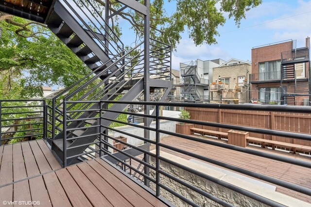 921 N Honore St Unit B, Chicago, IL 60622 - wooden deck with stairway and a residential view