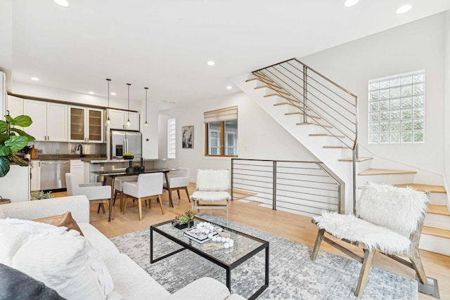 921 N Honore St Unit B, Chicago, IL 60622 - living area featuring recessed lighting, light wood-type flooring, stairway, and baseboards