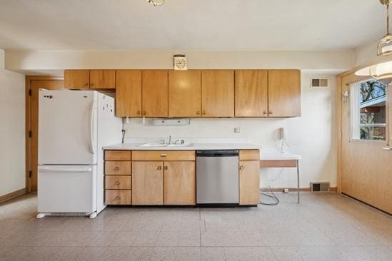 5623 N Manor Ln, Norwood Park, IL 60631 - kitchen featuring dishwasher, freestanding refrigerator, a sink, and light countertops