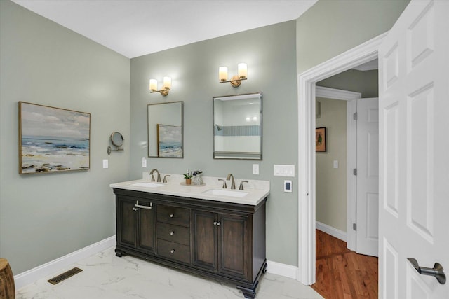 2502 Prairie Ridge Pl, Champaign, IL 61822 - bathroom with double vanity, marble finish floors, and baseboards