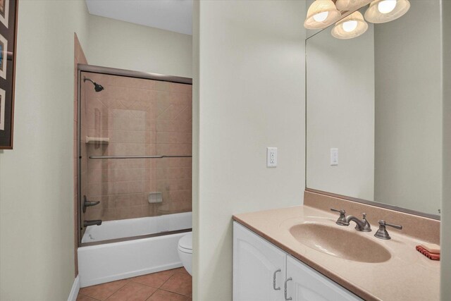 2502 Prairie Ridge Pl, Champaign, IL 61822 - bathroom featuring tile patterned flooring, vanity, toilet, tub / shower combination, and baseboards
