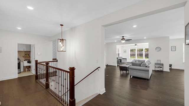 16002 S Selfridge Cir, Plainfield, IL 60586 - hall featuring an upstairs landing, dark wood-style flooring, recessed lighting, and baseboards