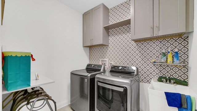 16002 S Selfridge Cir, Plainfield, IL 60586 - washroom with washing machine and dryer, cabinet space, and baseboards