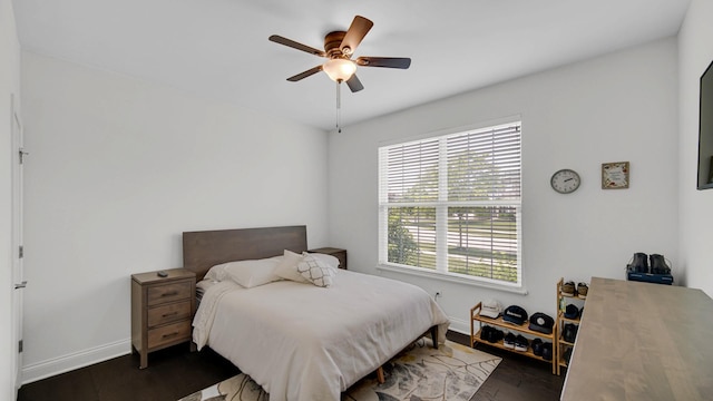 16002 S Selfridge Cir, Plainfield, IL 60586 - bedroom with multiple windows, baseboards, a ceiling fan, and wood finished floors