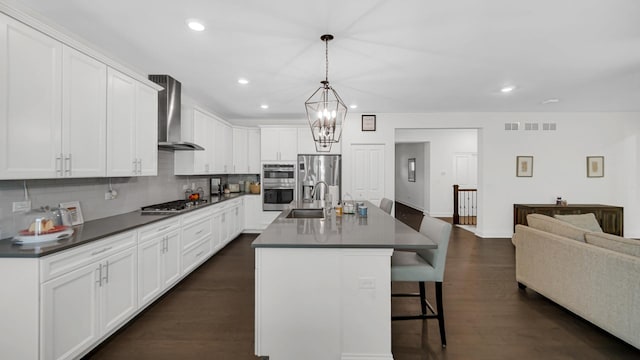 16002 S Selfridge Cir, Plainfield, IL 60586 - kitchen featuring wall chimney range hood, stainless steel appliances, a sink, dark countertops, and tasteful backsplash