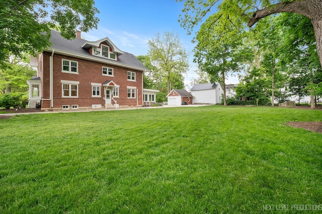 352 Elm St, Batavia, IL 60510 - rear view of property featuring a chimney, brick siding, and a lawn