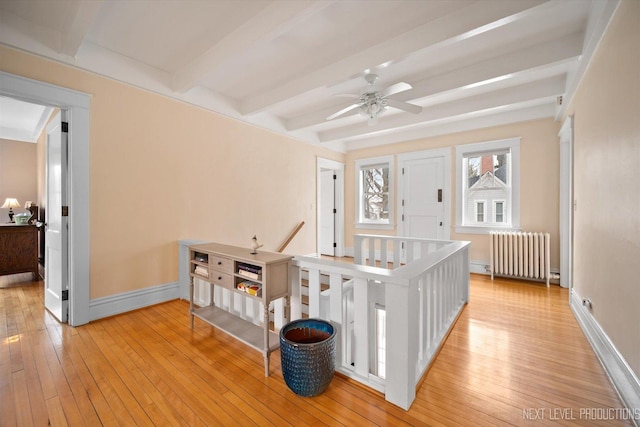 352 Elm St, Batavia, IL 60510 - corridor with radiator, beamed ceiling, an upstairs landing, baseboards, and light wood finished floors