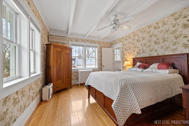 352 Elm St, Batavia, IL 60510 - bedroom with radiator, wallpapered walls, a wall mounted AC, light wood finished floors, and beamed ceiling