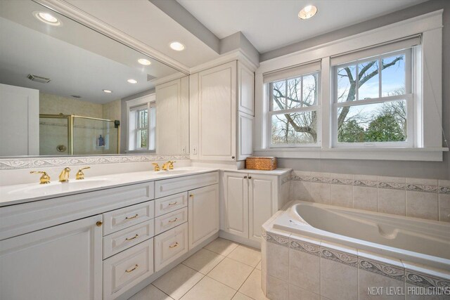 352 Elm St, Batavia, IL 60510 - bathroom featuring a stall shower, tile patterned floors, double vanity, a garden tub, and recessed lighting