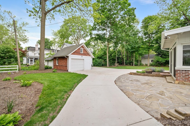 352 Elm St, Batavia, IL 60510 - view of property exterior with a garage, brick siding, and driveway