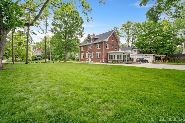 352 Elm St, Batavia, IL 60510 - view of grassy yard featuring a sunroom