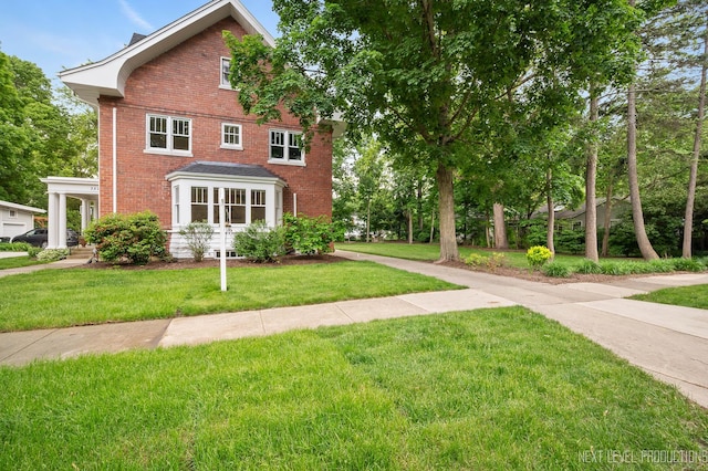 352 Elm St, Batavia, IL 60510 - view of front facade with brick siding and a front lawn