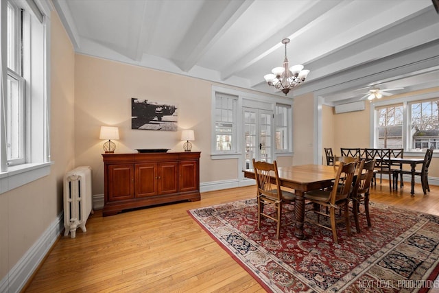 352 Elm St, Batavia, IL 60510 - dining space with radiator, light wood finished floors, an AC wall unit, a chandelier, and baseboards