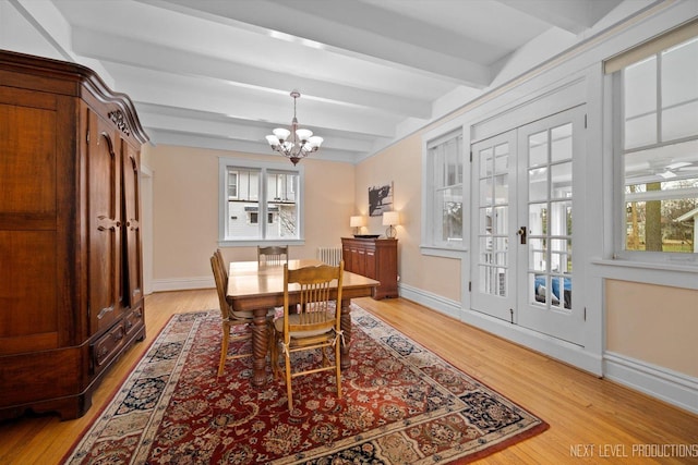 352 Elm St, Batavia, IL 60510 - dining space featuring light wood-style floors, a chandelier, baseboards, beam ceiling, and healthy amount of natural light