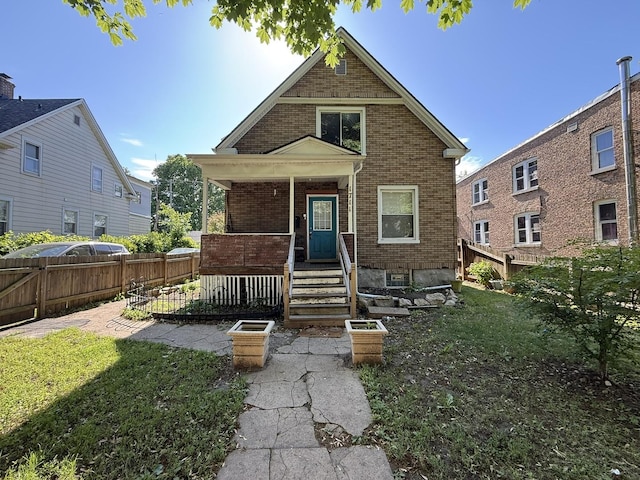1711 S 4th St, Rockford, IL 61104 - view of front of home with brick siding and a porch