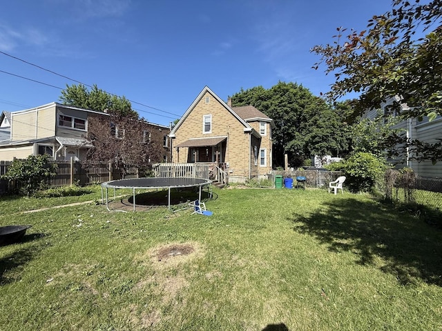 1711 S 4th St, Rockford, IL 61104 - rear view of house featuring a trampoline and brick siding