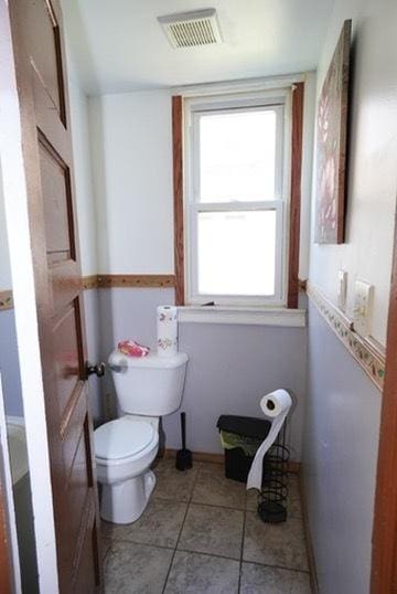 1711 S 4th St, Rockford, IL 61104 - bathroom featuring toilet, tile patterned flooring, and baseboards