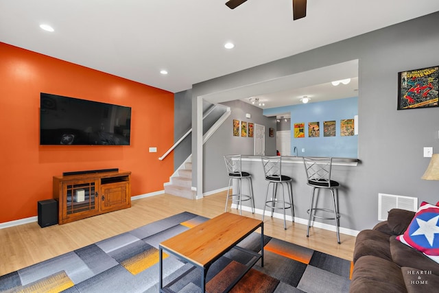 2015 Limestone Ln, Carpentersville, IL 60110 - living area with bar with sink, stairs, wood finished floors, recessed lighting, and baseboards
