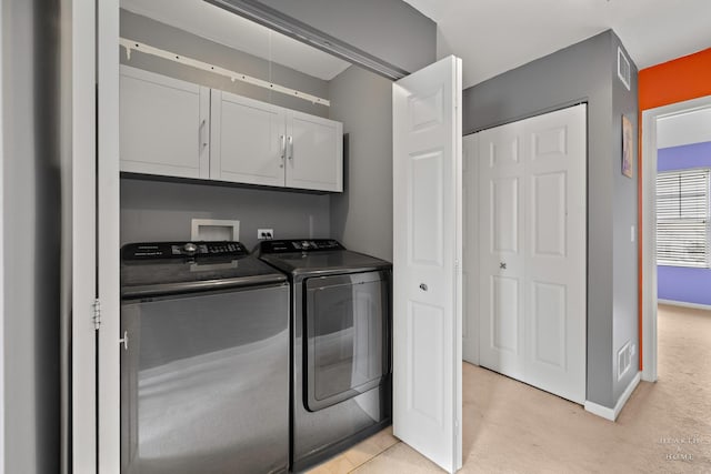 2015 Limestone Ln, Carpentersville, IL 60110 - laundry room with cabinet space, separate washer and dryer, light carpet, and baseboards