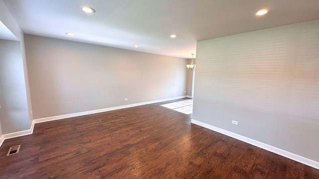 22500 Pleasant Dr, Richton Park, IL 60471 - unfurnished room with a chandelier, recessed lighting, dark wood-type flooring, and baseboards