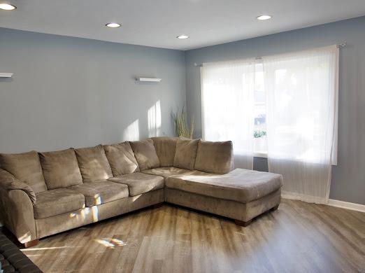 1216 Townley Dr, Bloomington, IL 61704 - living area featuring wood finished floors and recessed lighting