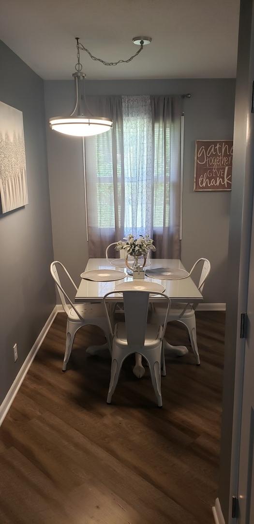 1216 Townley Dr, Bloomington, IL 61704 - dining space with baseboards and wood finished floors