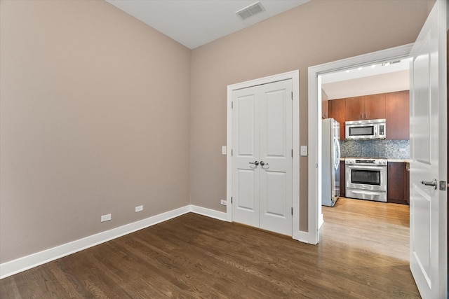 6 N May St Unit 403, Chicago, IL 60607 - spare room featuring wood finished floors and baseboards