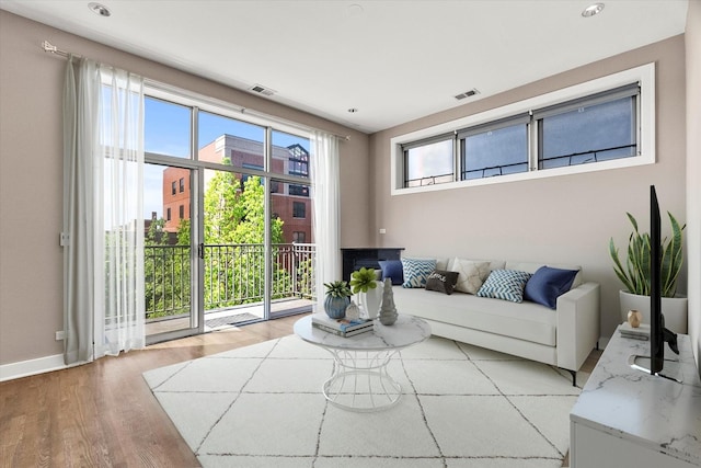 6 N May St Unit 403, Chicago, IL 60607 - living area with plenty of natural light, baseboards, and light wood-type flooring