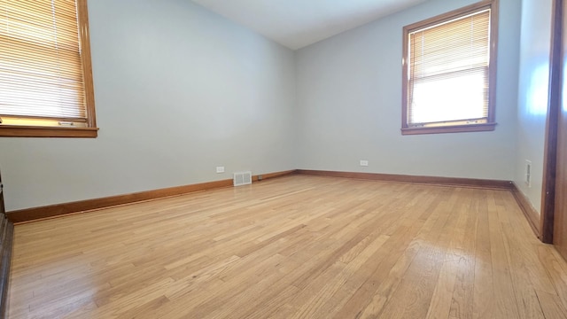 3544 Louis St, Franklin Park, IL 60131 - spare room with light wood-style flooring, vaulted ceiling, and baseboards
