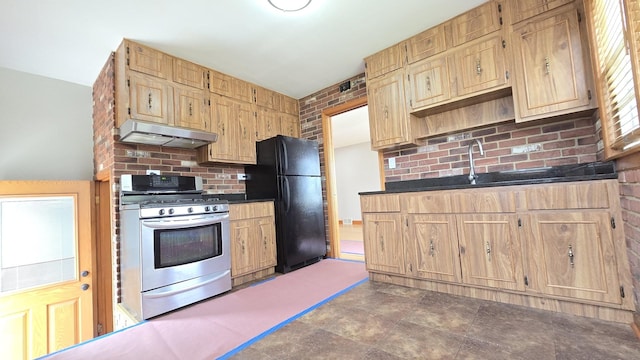 3544 Louis St, Franklin Park, IL 60131 - kitchen with stainless steel range with gas stovetop, freestanding refrigerator, under cabinet range hood, dark countertops, and decorative backsplash