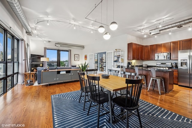 4020 N Damen Ave Unit 408, Chicago, IL 60618 - dining area featuring track lighting and wood finished floors