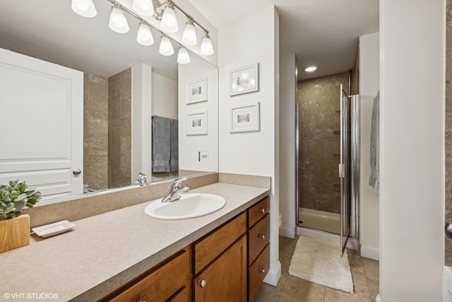 4020 N Damen Ave Unit 408, Chicago, IL 60618 - bathroom with vanity, a stall shower, and tile patterned floors