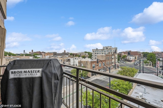 4020 N Damen Ave Unit 408, Chicago, IL 60618 - balcony featuring a city view and a grill
