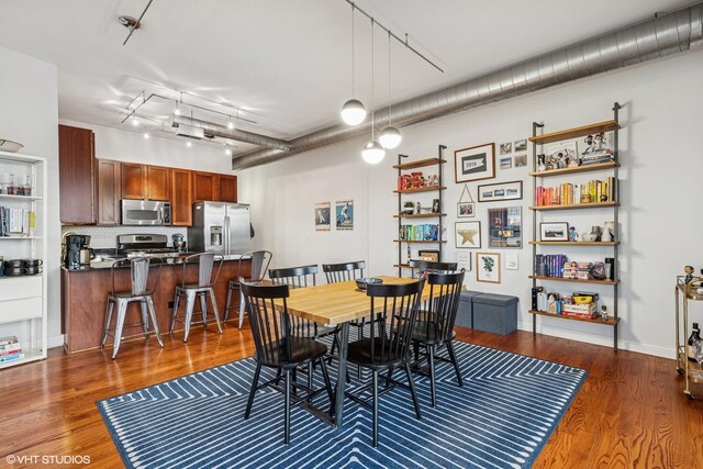 4020 N Damen Ave Unit 408, Chicago, IL 60618 - dining area with dark wood-style flooring and rail lighting