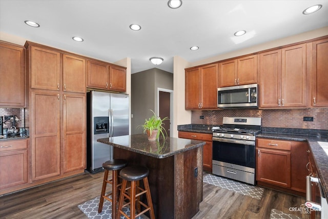 1104 Breckenridge Ln, Shorewood, IL 60404 - kitchen with stainless steel appliances, dark wood finished floors, brown cabinets, decorative backsplash, and recessed lighting