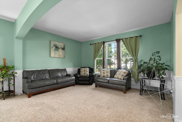 1104 Breckenridge Ln, Shorewood, IL 60404 - carpeted living area featuring a wainscoted wall and arched walkways