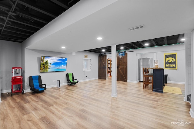 1104 Breckenridge Ln, Shorewood, IL 60404 - finished basement featuring freestanding refrigerator, light wood finished floors, and recessed lighting