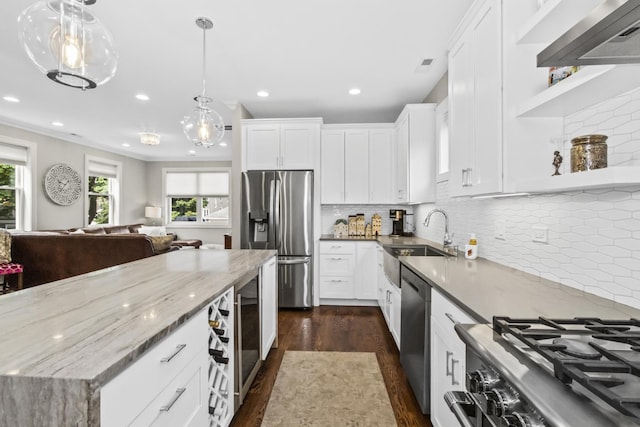 439 Thomas Ave, Forest Park, IL 60130 - kitchen with stainless steel appliances, wall chimney range hood, dark wood-style floors, plenty of natural light, and recessed lighting