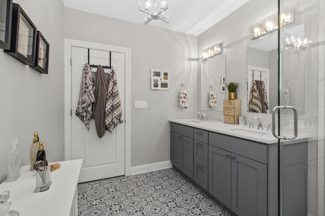 439 Thomas Ave, Forest Park, IL 60130 - bathroom with a chandelier, double vanity, a freestanding tub, and tile patterned flooring