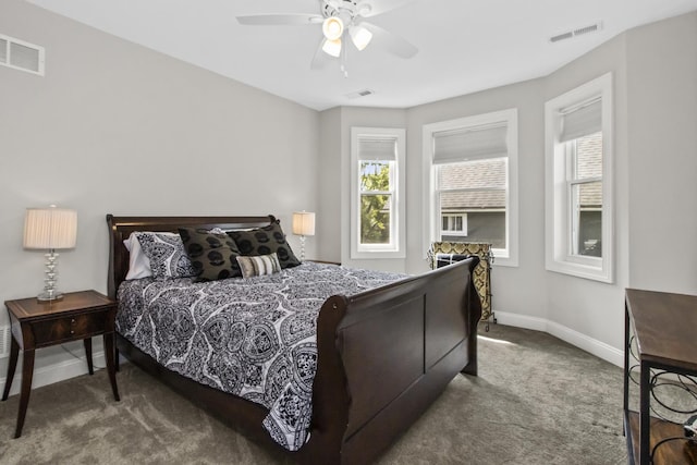 439 Thomas Ave, Forest Park, IL 60130 - carpeted bedroom with multiple windows and a ceiling fan