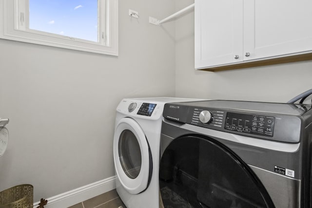 439 Thomas Ave, Forest Park, IL 60130 - laundry area featuring independent washer and dryer, cabinet space, and tile patterned flooring