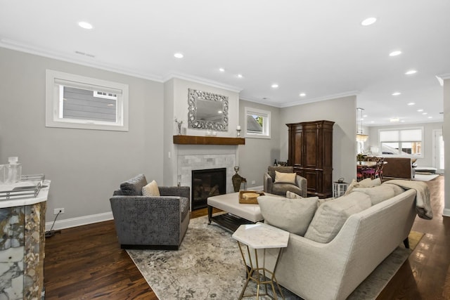 439 Thomas Ave, Forest Park, IL 60130 - living area featuring a tile fireplace, wood finished floors, healthy amount of natural light, recessed lighting, and ornamental molding