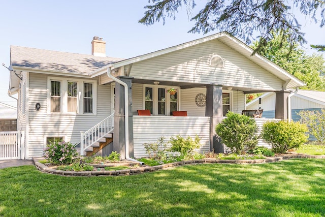 10 N Broadview Ave, Lombard, IL 60148 - view of front of property with a chimney, covered porch, a front lawn, and roof with shingles